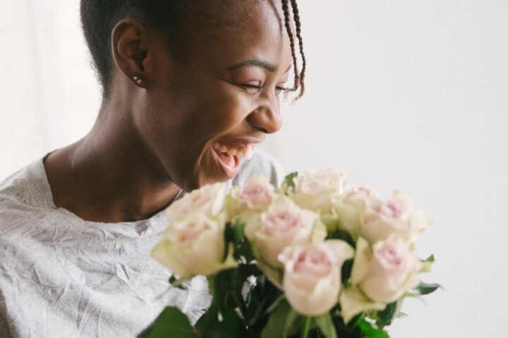 woman holding white flower bouquet